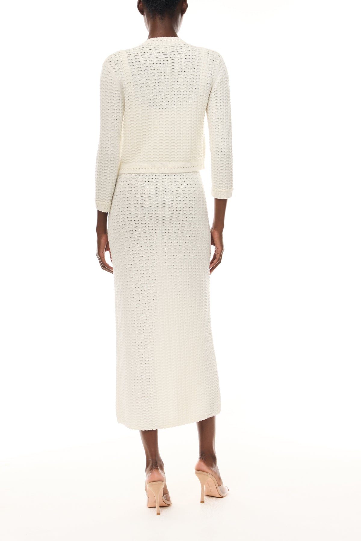 Monique Lhuillier Spring 2026 Ivory Cotton Viscose Knit Lace stitch cardigan with gold buttons with coordinating dress - back.
