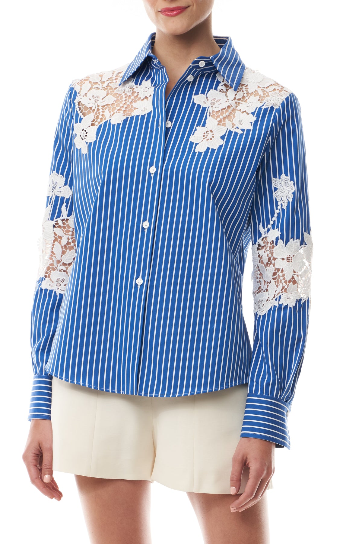 Monique Lhuillier Spring 2025 Long sleeve, button front collared striped shirt with lace detailing in Nautical Blue poplin with White lace details - front crop.