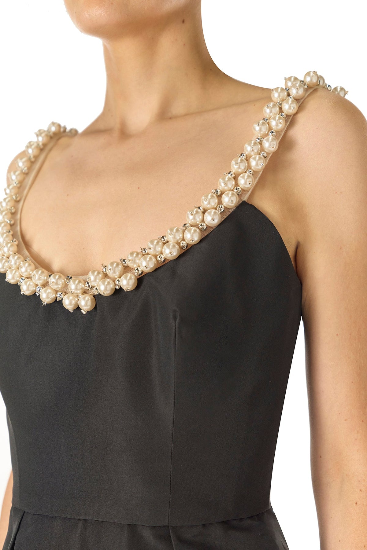 Monique Lhuillier Fall 2024 Sleeveless, scoop neck cocktail dress with pockets and pearl embroidered neckline in noir silk faille - neckline.